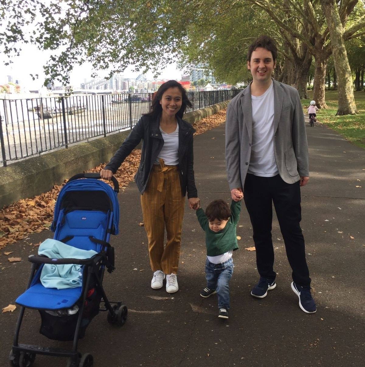 Chris Sharp with his wife and young son, walking along the Embankment in London