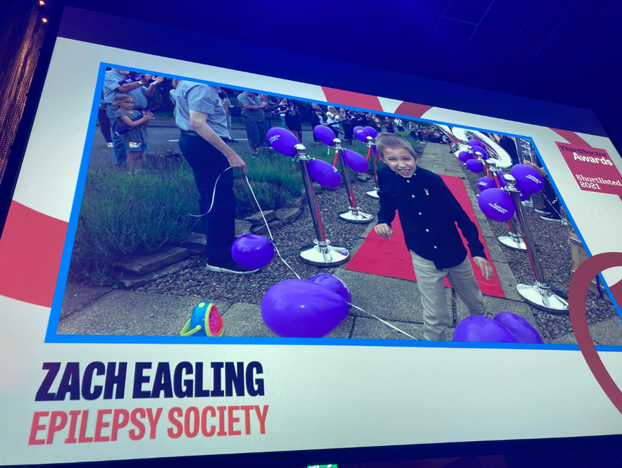 A picture of a screen at the Third Sector Awards ceremony showing Zach Eagling and his name and the Third Sector logo